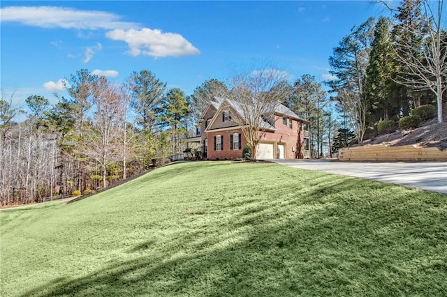 exterior space featuring a garage and a front yard