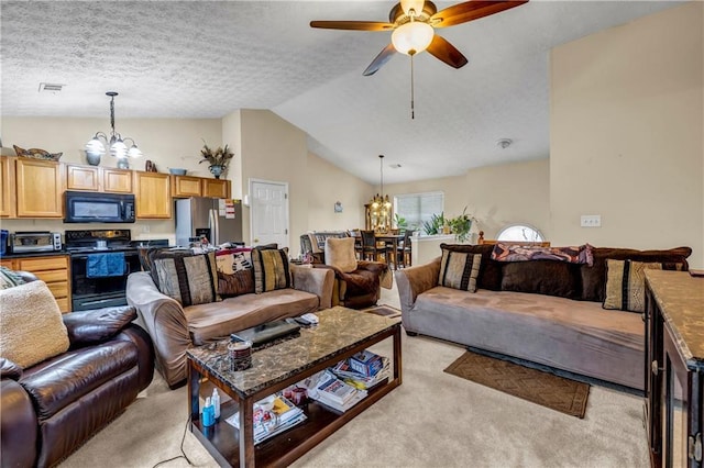 living area featuring visible vents, light carpet, a textured ceiling, lofted ceiling, and ceiling fan with notable chandelier