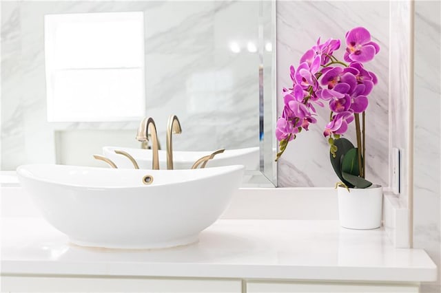 bathroom featuring a tub to relax in and sink