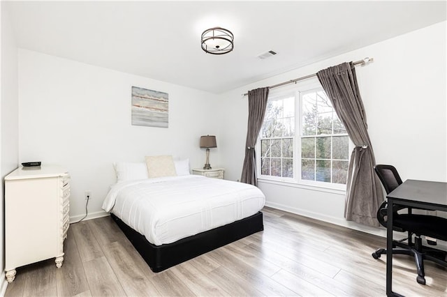 bedroom with wood-type flooring