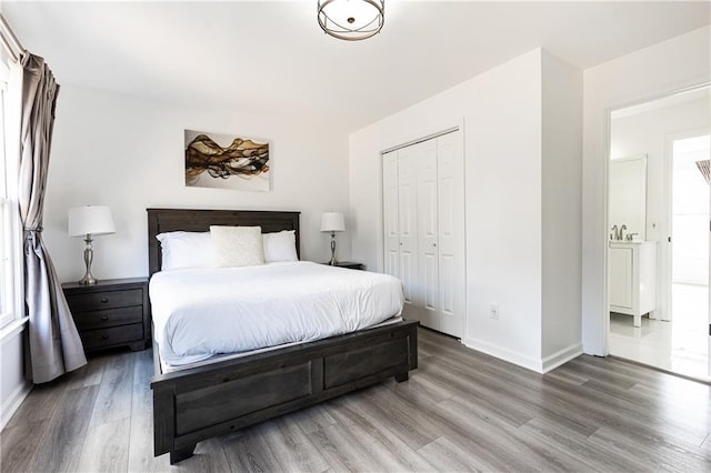 bedroom featuring hardwood / wood-style flooring and a closet