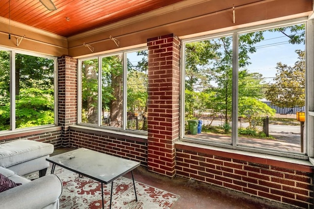 sunroom featuring wood ceiling