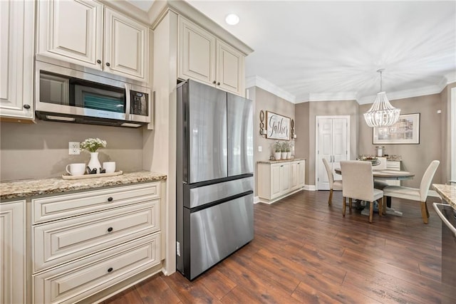 3232 Cates Ave NE, Brookhaven, GA 30319 - kitchen featuring stainless steel appliances, a chandelier, dark wood-style flooring, light stone countertops, and crown molding