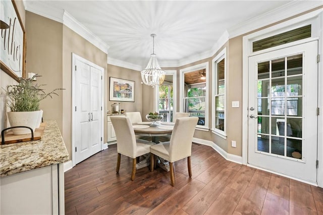 3232 Cates Ave NE, Brookhaven, GA 30319 - dining area featuring a chandelier, dark wood-type flooring, ornamental molding, and baseboards