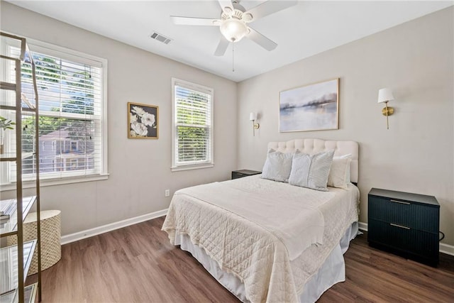3232 Cates Ave NE, Brookhaven, GA 30319 - bedroom with wood finished floors, baseboards, and ceiling fan