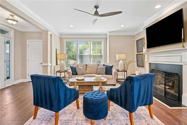 3232 Cates Ave NE, Brookhaven, GA 30319 - living area with wood finished floors, a ceiling fan, a fireplace, crown molding, and recessed lighting