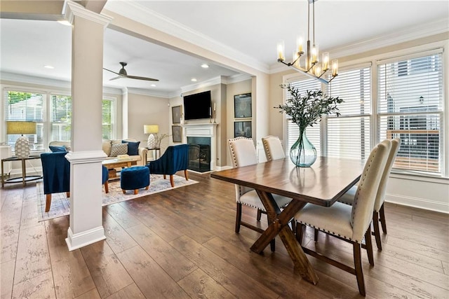3232 Cates Ave NE, Brookhaven, GA 30319 - dining space with decorative columns, dark wood-type flooring, a fireplace, recessed lighting, and ornamental molding