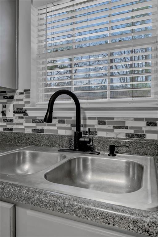 interior details with sink and backsplash