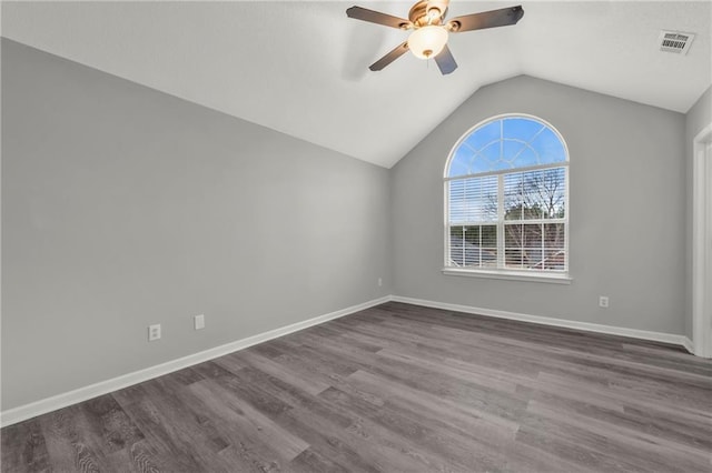 unfurnished room with vaulted ceiling, ceiling fan, and dark hardwood / wood-style flooring