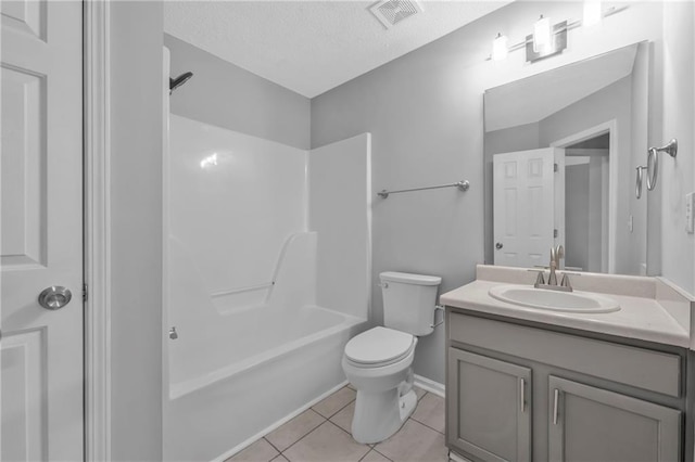 full bathroom with shower / tub combination, vanity, toilet, tile patterned floors, and a textured ceiling