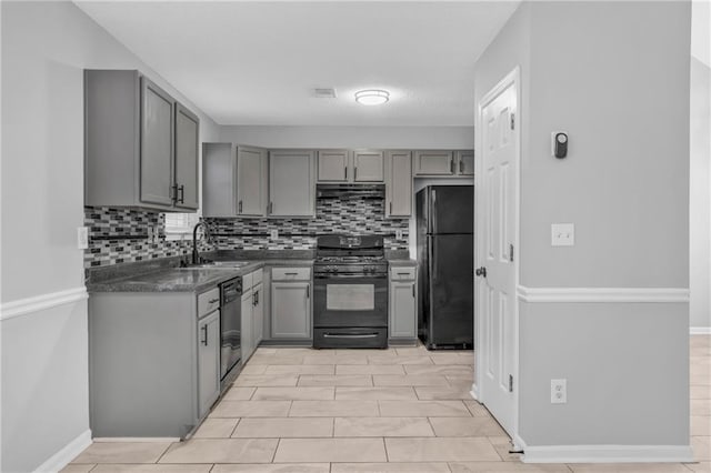 kitchen with sink, gray cabinetry, and black appliances