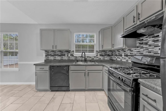 kitchen with sink, a wealth of natural light, gray cabinets, and black appliances