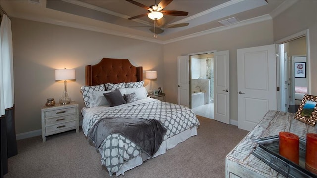 bedroom with ensuite bathroom, crown molding, a raised ceiling, ceiling fan, and carpet