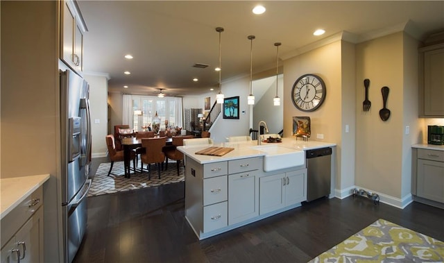 kitchen featuring gray cabinets, pendant lighting, sink, kitchen peninsula, and stainless steel appliances