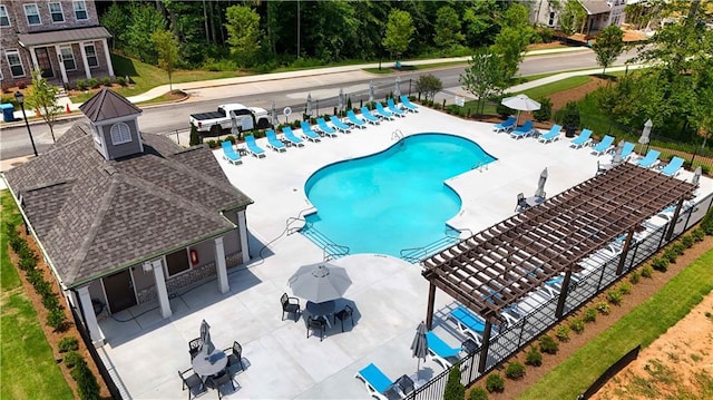 view of swimming pool featuring a patio and a pergola