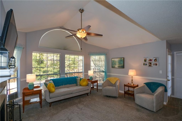 carpeted living room with lofted ceiling and ceiling fan