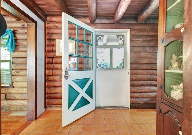 entryway featuring wooden ceiling, log walls, and beam ceiling