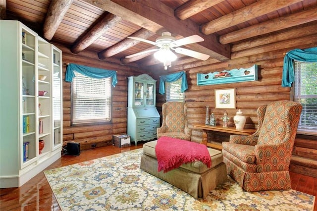 living area with wood ceiling, rustic walls, and hardwood / wood-style flooring