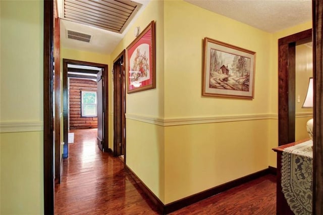 hall featuring dark wood-type flooring