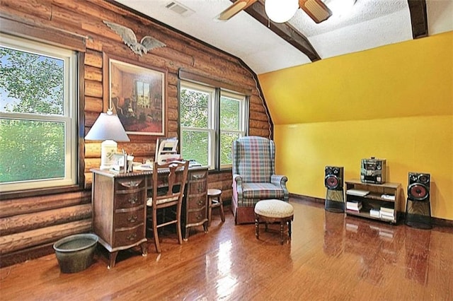 office featuring wood-type flooring, rustic walls, lofted ceiling, and a textured ceiling