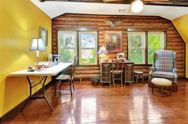 sitting room with hardwood / wood-style floors, log walls, and vaulted ceiling