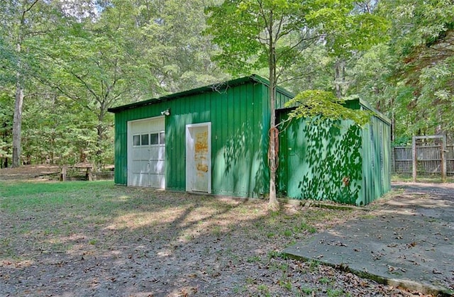 view of outbuilding featuring a garage