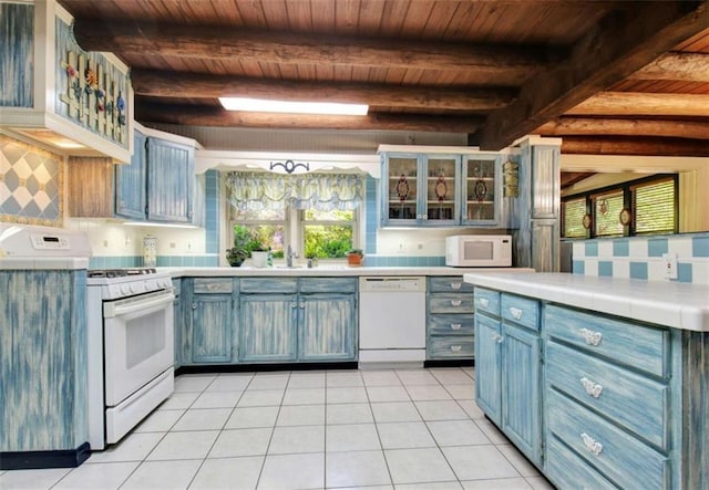 kitchen featuring light tile patterned floors, wood ceiling, and white appliances