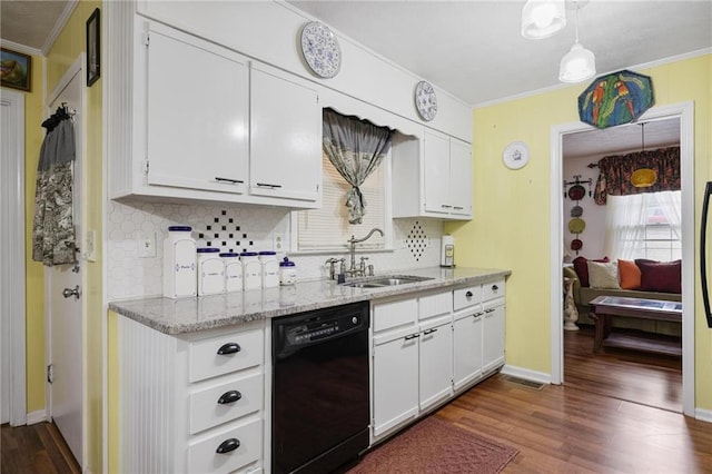 kitchen with hanging light fixtures, black dishwasher, sink, and white cabinets