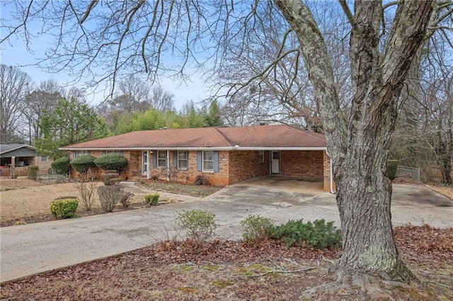 ranch-style house featuring a carport