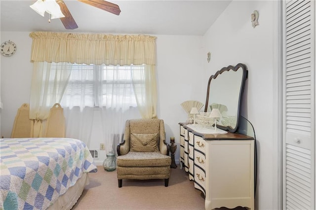 carpeted bedroom featuring ceiling fan