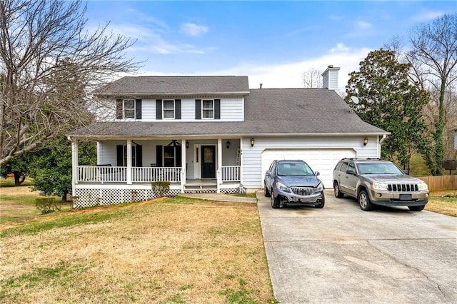 traditional-style house featuring a chimney, covered porch, concrete driveway, a front yard, and a garage