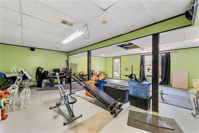 exercise room featuring a drop ceiling and visible vents