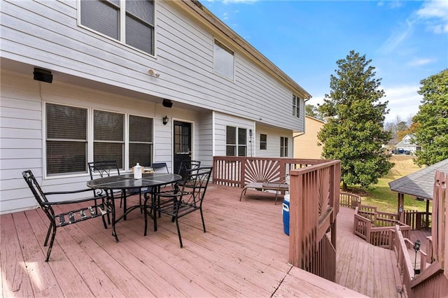 deck with outdoor dining space