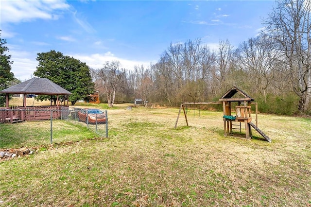 view of yard featuring a gazebo and a playground