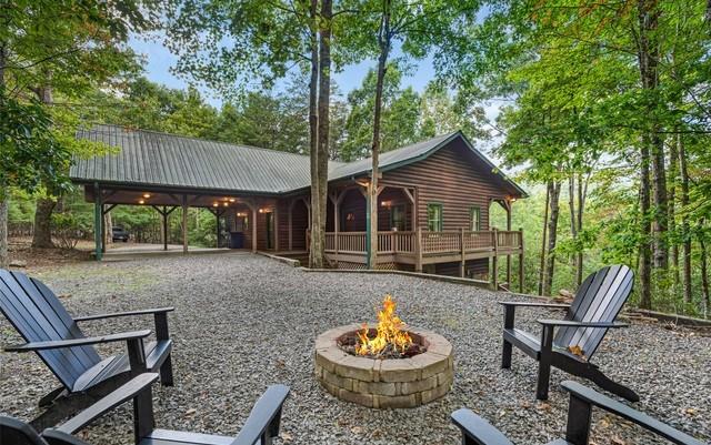 view of community with a patio and a fire pit