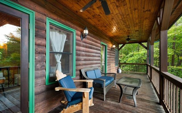 wooden deck featuring a porch and ceiling fan