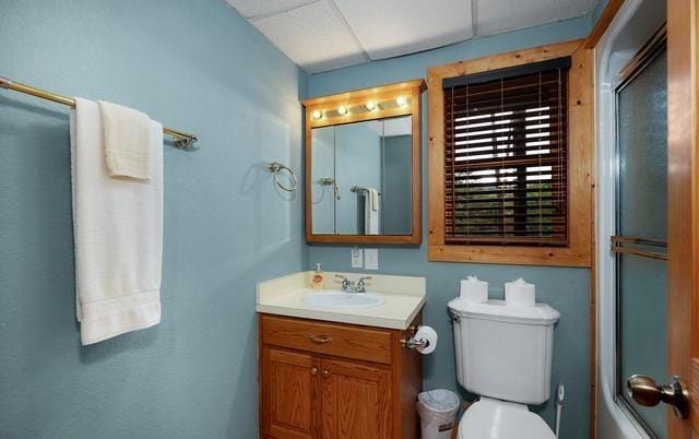 full bathroom featuring vanity, toilet, and combined bath / shower with glass door