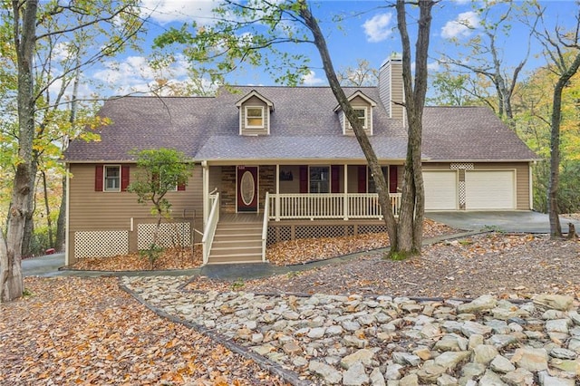 view of front of home featuring a garage and a porch