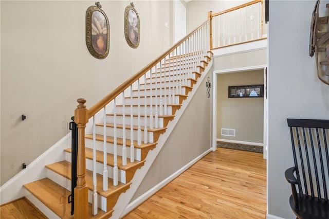 staircase featuring hardwood / wood-style floors