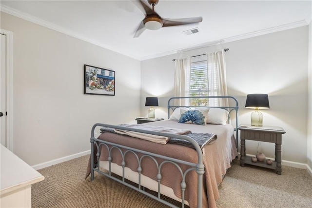 carpeted bedroom with ornamental molding and ceiling fan