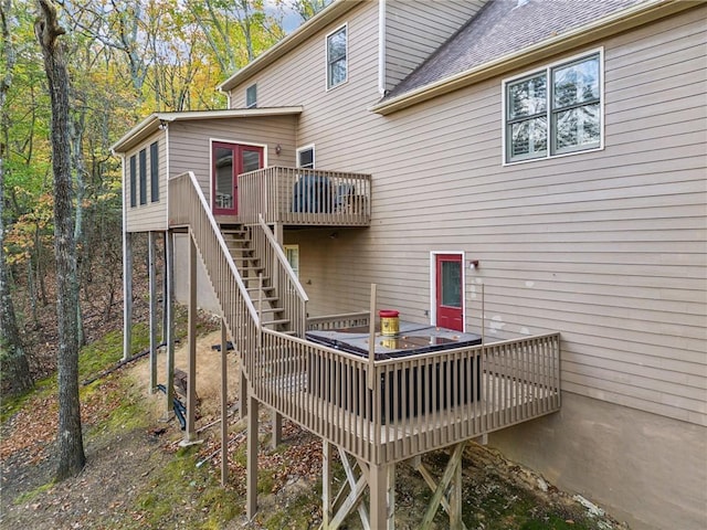 back of property featuring a deck