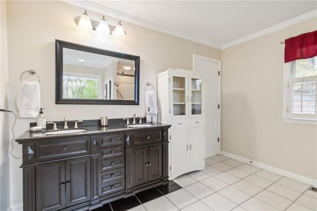 bathroom with ornamental molding, tile patterned flooring, and vanity