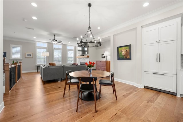 dining room with recessed lighting, baseboards, ornamental molding, and light wood finished floors