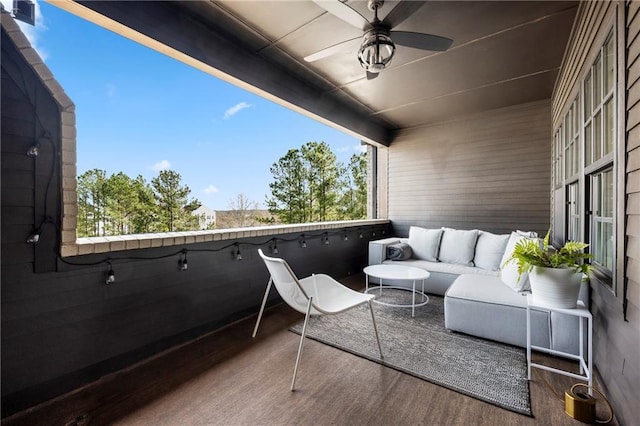 balcony with an outdoor hangout area and ceiling fan