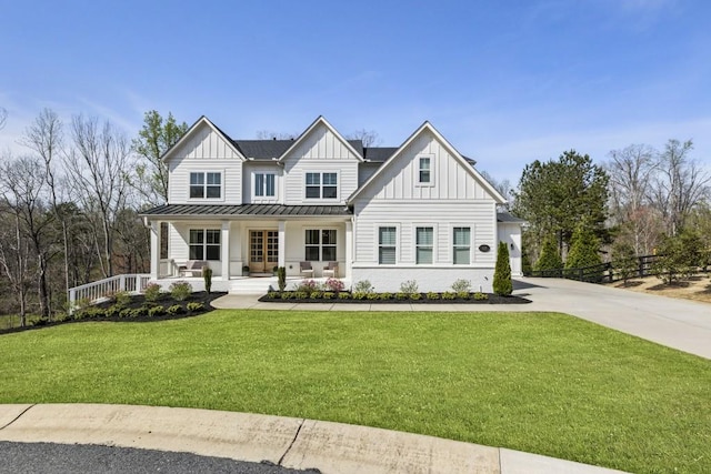 828 Chestnut Pl, Milton, GA 30004 - modern farmhouse style home with board and batten siding, covered porch, a standing seam roof, concrete driveway, and metal roof