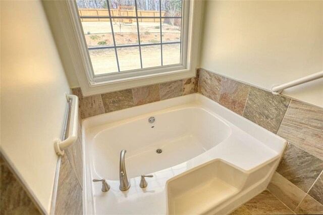 full bathroom featuring a garden tub