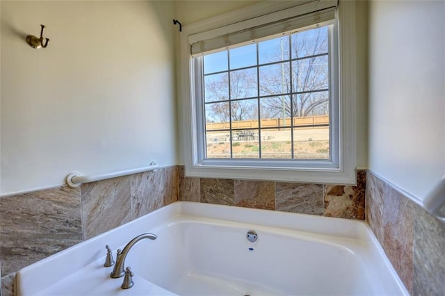 bathroom featuring a bath