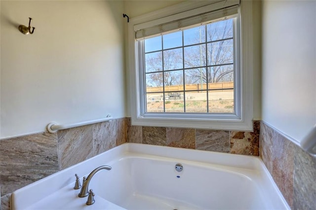 full bath with a garden tub