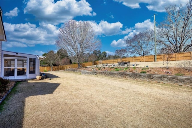 view of yard with a fenced backyard