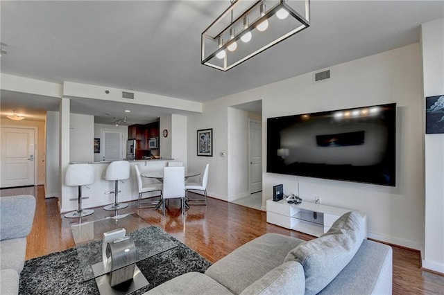 living room with hardwood / wood-style floors